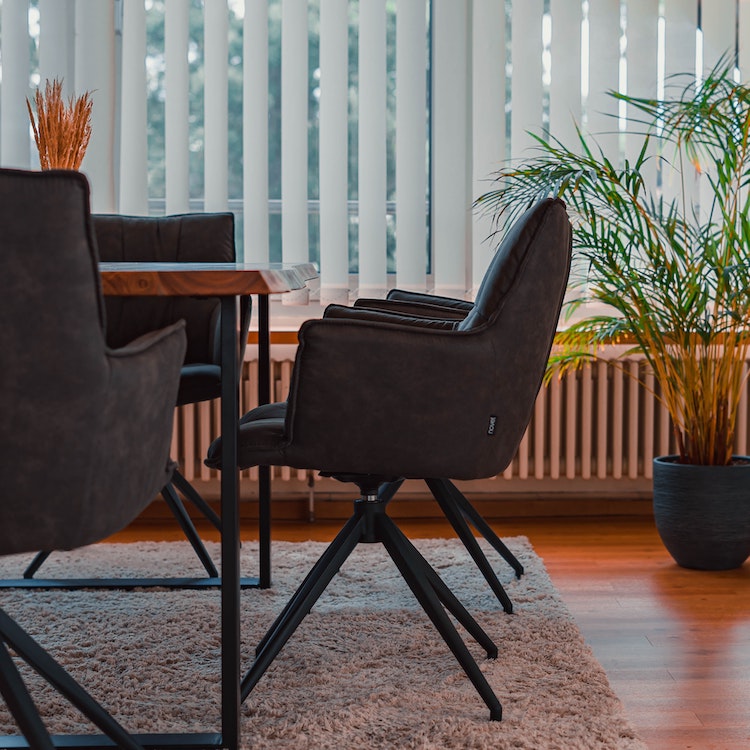 A dining room
                                        focusing on a stylish chair